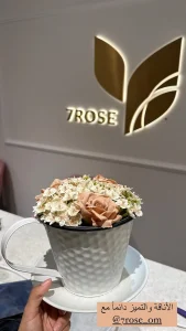 Decoration white cup of coffee vase with flowers
