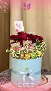 blue velour box for chocolates (with golden, brown and green packaging). Cookies pckaged, red roses, baby's breath. - Copie